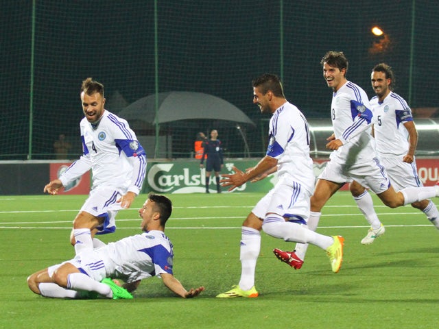 San Marino's Matteo Vitaioli celebrates after scoring with his team-mates during the UEFA Euro 2016 qualifying group E football match between Lithuania and San Marino in Vilnius on September 8, 2015