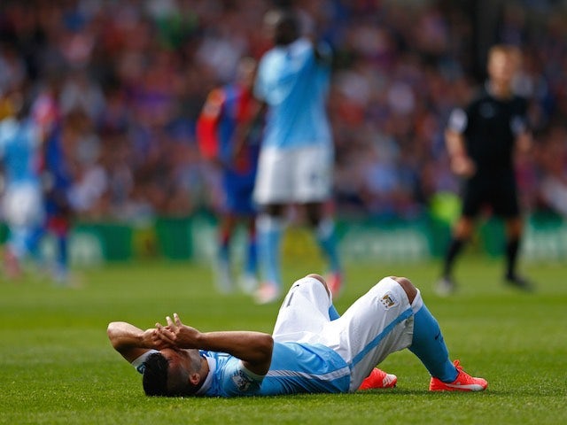 Man City striker Sergio Aguero lies injured during the game with Crystal Palace on September 12, 2015