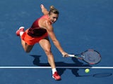 Simona Halep of Romania returns a shot against Sabine Lisicki of Germany during their Women's Singles Fourth Round match on Day Eight of the 2015 US Open at the USTA Billie Jean King National Tennis Center on September 7, 2015 in the Flushing neighborhood