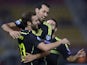 Spain's Midfielder Juan Mata (L) celebrates with his teammate midfielder Sergio Busquets (C) after scoring during the Euro 2016 Group C qualifying football match between Macedonia and Spain at the Filip II Arena stadium in Skopje on September 8, 2015