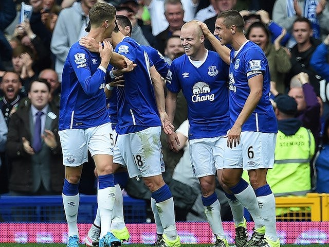 Steven Naismith is congratulated by teammates after he completes his hat-trick against Chelsea on September 12, 2015