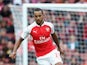 Theo Walcott of Arsenal runs with the ball during the Emirates Cup match between Arsenal and VfL Wolfsburg at the Emirates Stadium on July 26, 2015