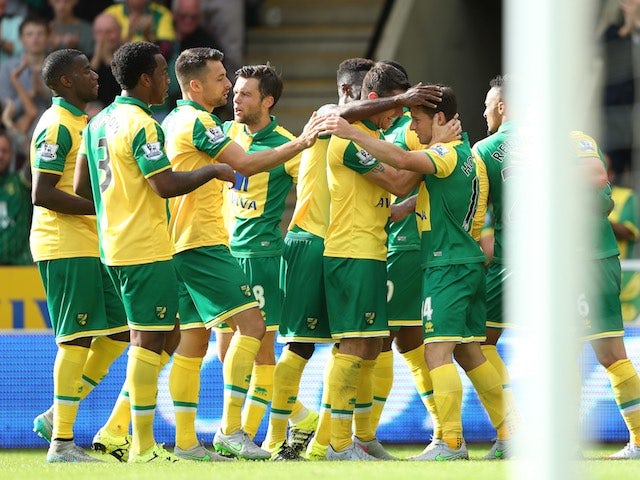 Wes Hoolahan is congratulated by teammates after scoring Norwich's second against Bournemouth on September 12, 2015