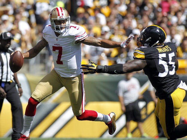 Colin Kaepernick #7 of the San Francisco 49ers avoids the rush by Arthur Moats #55 of the Pittsburgh Steelers in the first quarter during the game on September 20, 2015 at Heinz Field in Pittsburgh, Pennsylvania. 