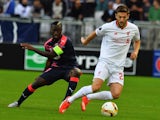 Bordeaux's French Senegalese forward Henri Saivet (L) vies with Liverpool's midfielder Adam Lallana (R) during the UEFA Europa League Group B football match Bordeaux vs Liverpool on September 17, 2015 at the Matmut Atlantique stadium in Bordeaux.