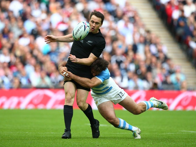 Marcelo Bosch of Argentina tackles Ben Smith of the New Zealand All Blacks during the 2015 Rugby World Cup Pool C match between New Zealand and Argentina at Wembley Stadium on September 20, 2015 