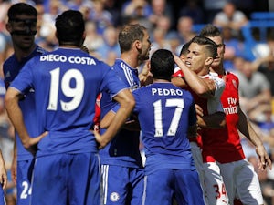 Arsenal's Brazilian defender Gabriel (2nd R) reacts after being sent off by referee Mike Dean (not pictured) during the English Premier League football match between Chelsea and Arsenal at Stamford Bridge in London on September 19, 2015