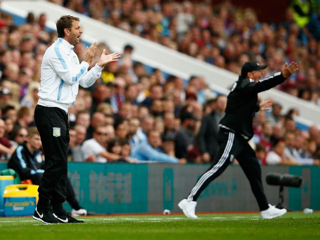 Tim Sherwood Manager of Aston Villa and Tony Pulis manager of West Bromwich Albion gesture during the Barclays Premier League match between Aston Villa and West Bromwich Albion at Villa Park on September 19, 2015 in Birmingham, United Kingdom.