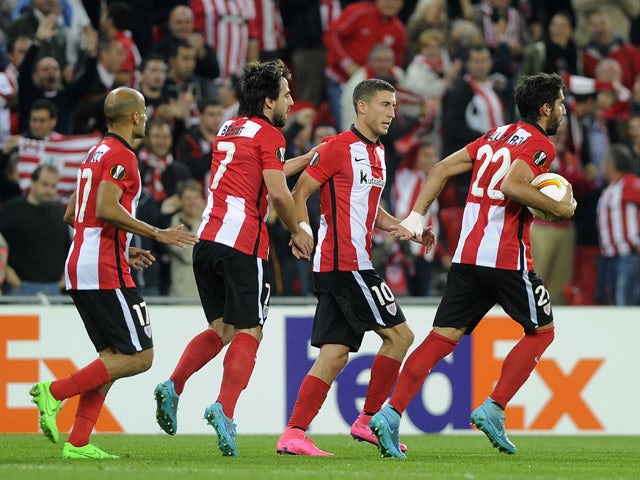 Athletic Bilbao's forward Aritz Aduriz (R) celebrates with midfielder Oscar De Marcos (2ndR) and teammates after scoring during the UEFA Europa League group L football match Athletic Club Bilbao vs FC Ausburg at the San Mames stadium in Bilbao on Septembe