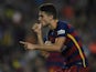 Barcelona's defender Marc Bartra celebrates after scoring a goal during the Spanish league football match FC Barcelona vs Levante UD at the Camp Nou stadium in Barcelona on September 20, 2015.
