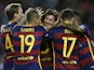Barcelona's defender Marc Bartra (hidden) celebrates with Barcelona's Argentinian forward Lionel Messi (C) and teammates after scoring during the Spanish league football match FC Barcelona vs Levante UD at the Camp Nou stadium in Barcelona on September 20