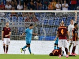 Barcelona's Uruguayan forward Luis Suarez celebrates after scoring against AS Roma during the UEFA Champions League football match between AS Roma and FC Barcelona at the Rome Olympic stadium, on September 16, 2015