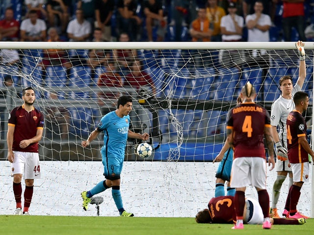 Barcelona's Uruguayan forward Luis Suarez celebrates after scoring against AS Roma during the UEFA Champions League football match between AS Roma and FC Barcelona at the Rome Olympic stadium, on September 16, 2015