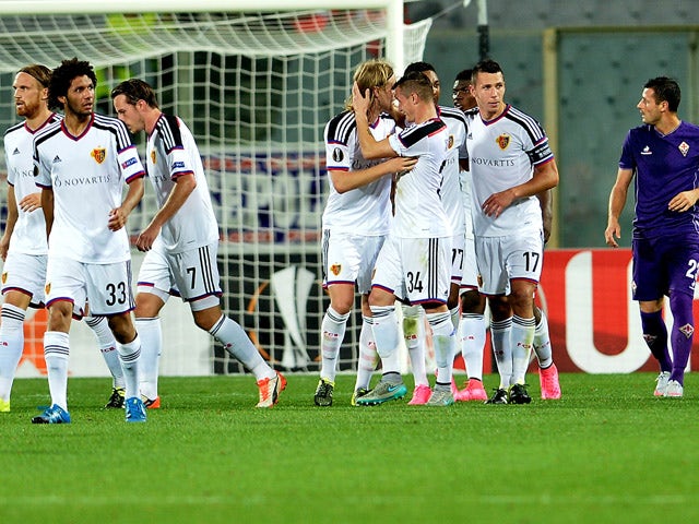 Basel's midfielder Birkir Bjarnason (C) celebrates with teammates after scoring a goal during the UEFA Europa League football match between Fiorentina and Basel on September 17, 2015
