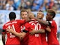 Bayern Munich's midfielder Sebastian Rode (C) is congratulated by teammates after scoring the 3-0 during the German first division Bundesliga football match SV Darmstadt 98 vs FC Bayern Munich in Darmstadt, western Germany on September 19, 2015