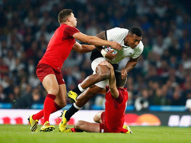 Ben Youngs (L) and George Ford of England tackle Waisea Nayacalevu of Fiji during the 2015 Rugby World Cup Pool A match between England and Fiji at Twickenham Stadium on September 18, 2015 in London, United Kingdom.