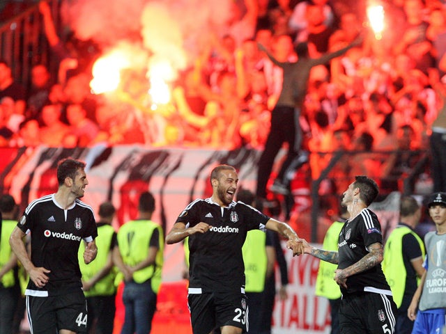 Besiktas' players celebrate after scoring during the UEFA Europa League Group H football match between KF Skenderbeu and Besiktas JK at the Elbansan Arena in Elbasan on September 17, 2015