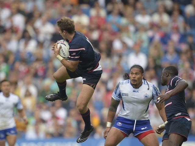 The USA's Blaine Scully jumps with the ball during the Rugby World Cup game with Samoa on September 20, 2015