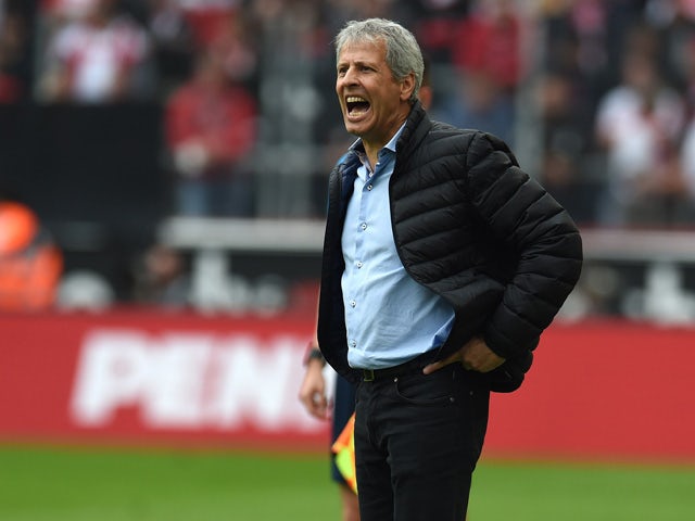 Monchengladbach's Swiss head coach Lucien Favre reacts during the German first division Bundesliga football match FC Cologne vs Borussia Monchengladbach in Cologne, western Germany on September 19, 2015