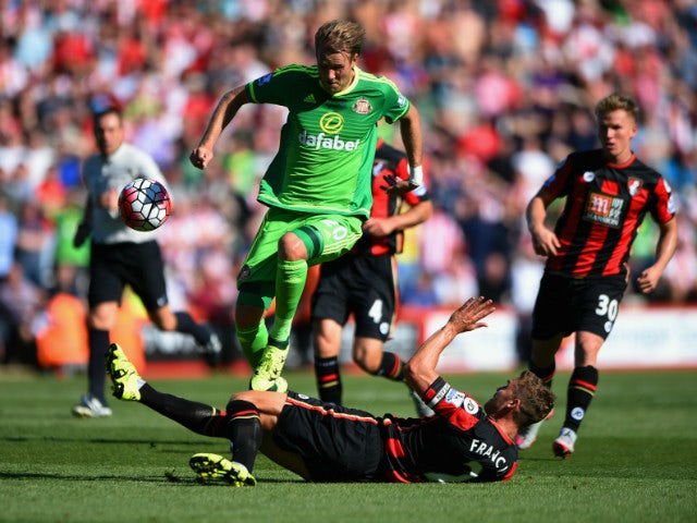 Ola Toivonen of Sunderland is tackled by Simon Francis of Bournemouth during the Barclays Premier League match between A.F.C. Bournemouth and Sunderland at Vitality Stadium on September 19, 2015 in Bournemouth, United Kingdom.