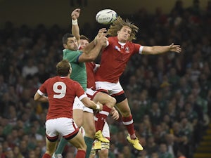 Canada's wing Jeff Hassler (R) jumps for the ball during a Pool D match of the 2015 Rugby World Cup between Ireland and Canada at the Millenium stadium in Cardiff, south Wales on September 19, 2015.