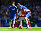 Chelsea's Serbian midfielder Nemanja Matic (R) vies with Arsenal's Chilean striker Alexis Sanchez during the English Premier League football match between Chelsea and Arsenal at Stamford Bridge in London on September 19, 2015