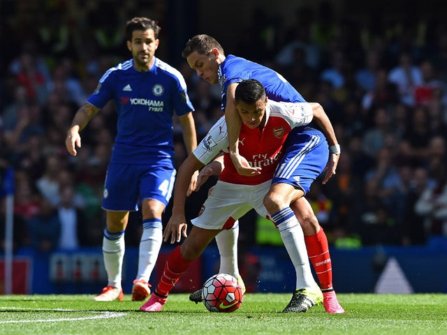 Chelsea's Serbian midfielder Nemanja Matic (R) vies with Arsenal's Chilean striker Alexis Sanchez during the English Premier League football match between Chelsea and Arsenal at Stamford Bridge in London on September 19, 2015