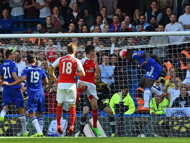 Chelsea's French defender Kurt Zouma heads the opening goal of the English Premier League football match between Chelsea and Arsenal at Stamford Bridge in London on September 19, 2015