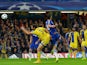 Maccabi Tel Aviv's Israeli defender Yuval Shpungin vies against Chelsea's Brazilian-born Spanish striker Diego Costa as he shoots to score the team's third goal during the UEFA Champions League, group G, football match between Chelsea and Maccabi Tel Aviv