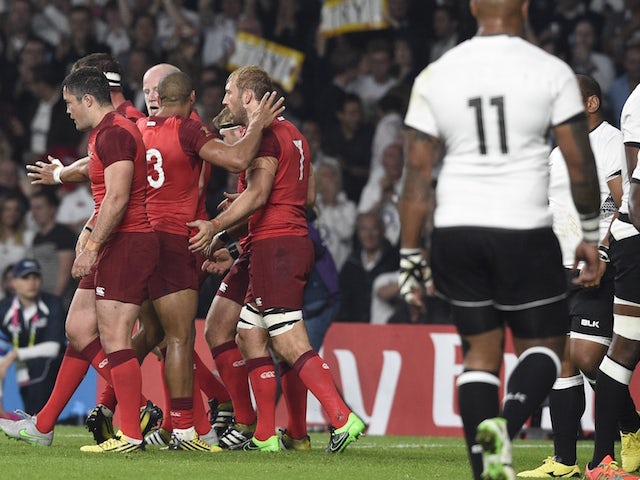 England's flanker and captain Chris Robshaw (C) celebrates a penalty try with teammates during a Pool A match of the 2015 Rugby World Cup between England and Fiji at Twickenham stadium in south west London on September 18, 2015.