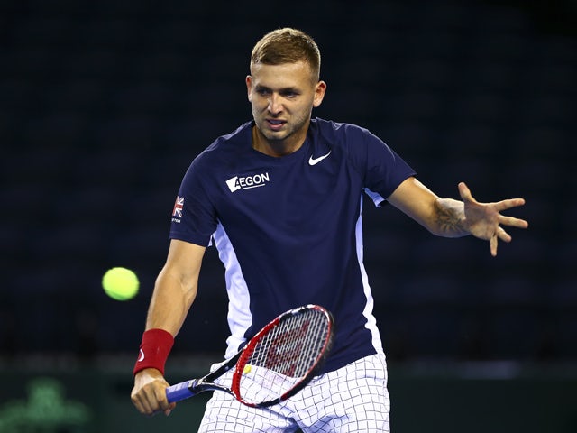 Dan Evans of Great Britain plays a backhand during a practice session at Emirates Arena on September 17, 2015