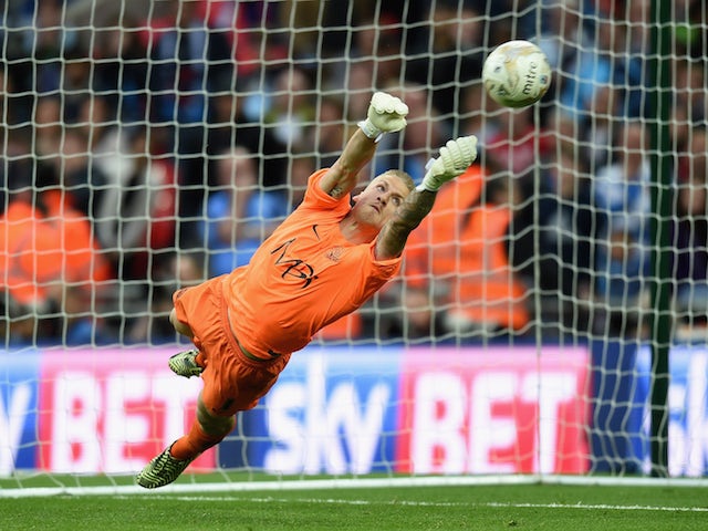 Daniel Bentley of Southend saves the final penalty in the shoot out to win the Sky Bet League Two Playoff Final match between Southend United and Wycombe Wanderers at Wembley Stadium on May 23, 2015 in London, England. 