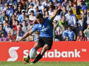 Uruguay's outside half Felipe Berchesi kicks the ball to score against Russia during the run-off qualifier match for Rugby World Cup 2015, at Charrua stadium in Montevideo on October 11, 2014