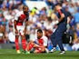 Francis Coquelin sits injured during the game between Chelsea and Arsenal on September 19, 2015