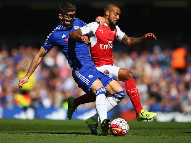 Gary 'Bane' Cahill and Theo Walcott battle for the ball during the game between Chelsea and Arsenal on September 19, 2015