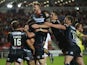 George Williams of Wigan Warriors is mobbed by teammates after scoring his second half try during the First Utility Super League match between St Helens and Wigan Warriors at Langtree Park on September 18, 2015 in St Helens, England.
