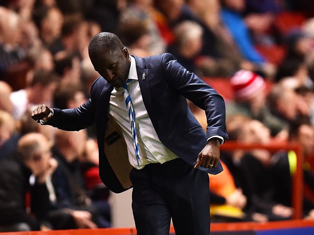 Manager of Huddersfield Town Chris Powell celebrates as Huddersfield score thie first goal during the Sky Bet Championship match between Charlton Athletic and Huddersfield Town at The Valley on September 15, 2015