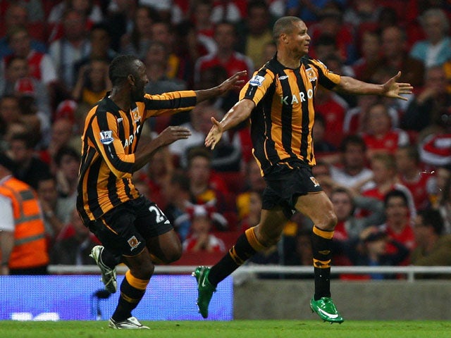 Daniel Cousin of Hull City celebrates with teammates after scoring during the Barclays Premier League match between Arsenal and Hull City at the Emirates Stadium on September 27, 2008