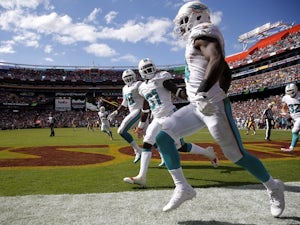 Dolphins sink Redskins with late show