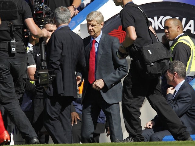 Jose Mourinho and Arsene Wenger shake hands prior to the game between Chelsea and Arsenal on September 19, 2015