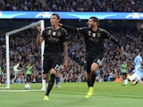 Juventus' forward from Croatia Mario Mandzukic (L) celebrates with Juventus' forward from Spain Alvaro Morata after scoring during a UEFA Champions League group stage football match between Manchester City and Juventus at the Etihad stadium in Manchester,