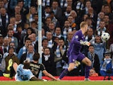 Juventus' forward from Croatia Mario Mandzukic (C) scores past Manchester City's English goalkeeper Joe Hart during a UEFA Champions League group stage football match between Manchester City and Juventus at the Etihad stadium in Manchester, north-west Eng