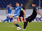 FC Dnipro's Ruslan Rotan (L) vies for a ball with Lazio's Wesley Hoedt (R) during the UEFA Europa League Group G football match between Dnipro Dnipropetrovsk and Lazio Rome on September 17, 2015