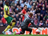 Liverpool's English striker Danny Ings scores his team's first goal past Norwich City's English goalkeeper John Ruddy (R) during the English Premier League football match between Liverpool and Norwich City at the Anfield stadium in Liverpool, north-west E