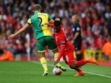  Steven Whittaker of Norwich City and Daniel Sturridge of Liverpool battle for the ball during the Barclays Premier League match between Liverpool and Norwich City at Anfield on September 20, 2015