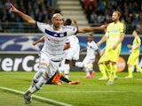 Christophe Jallet of Lyon celebrates scoring his teams first goal of the game during the UEFA Champions League Group H match between KAA Gent and Olympique Lyonnais held at Ghelamco Arena on September 16, 2015