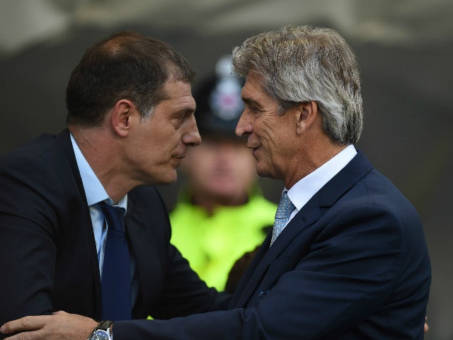 West Ham United's Croatian manager Slaven Bilic (L) greets Manchester City's Chilean manager Manuel Pellegrini (R) before the English Premier League football match between Manchester City and West Ham United at The Etihad Stadium in Manchester, north west