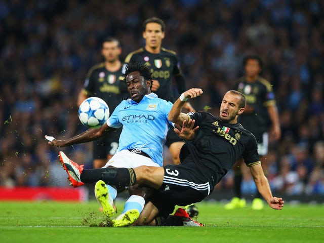 Wilfred Bony of Manchester City is tackled by Giorgio Chiellini of Juventus during the UEFA Champions League Group D match between Manchester City FC and Juventus at the Etihad Stadium on September 15, 2015