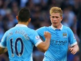 Kevin de Bruyne of Manchester City celebrates scoring his team's first goal with his team mate Sergio Aguero during the Barclays Premier League match between Manchester City and West Ham United at Etihad Stadium on September 19, 2015