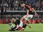 Manchester's Spanish midfielder Ander Herrera (R) vies with Eindhoven's Mexican midfielder Andres Guardado (L) during the UEFA Champions League Group B football match between PSV Eindhoven and Manchester United at the Philips stadium in Eindhoven, Belgium